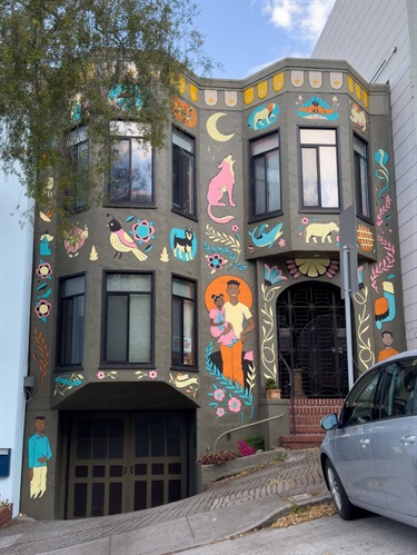 A mural painted on the exterior of a house. 
