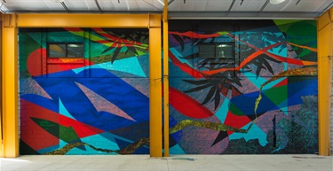 A mural painted on a building wall. 