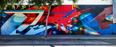 A mural painted on a building wall. 