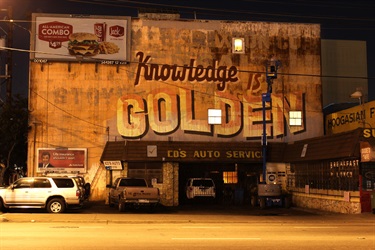 Text painted on the side of a building. 