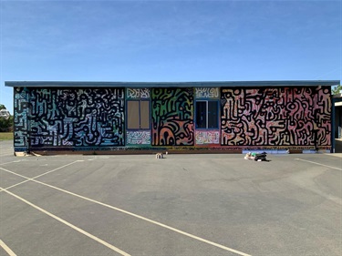 A mural painted on a building. 