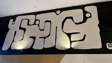 A black and white piece of artwork. 