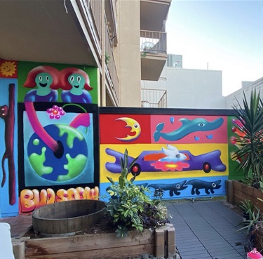 A mural painted on a building wall.