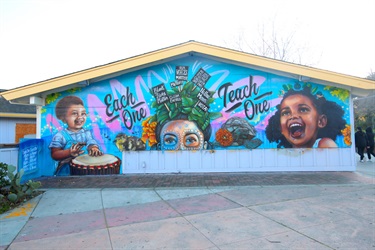 A mural painted on a building wall. 