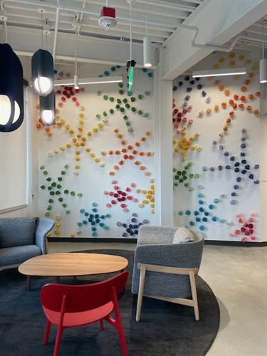 An abstract art installation on a wall. 