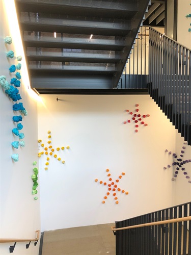 An abstract art installation on a wall. 