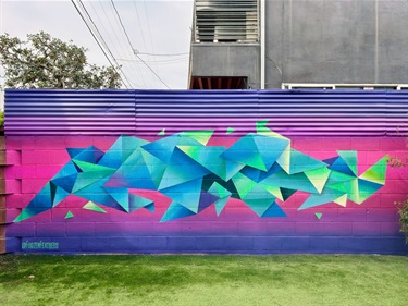 A mural painted on a building wall. 