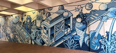 A mural painted on a building wall. 