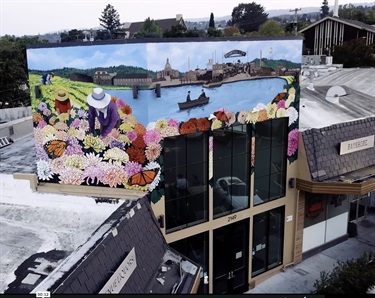 A mural painted on a building wall. 