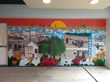 A mural painted on a building wall. 