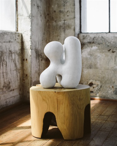 An abstract sculpture on a pedestal. 