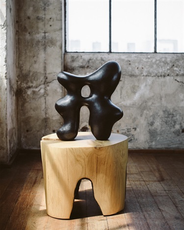 An abstract sculpture on a pedestal. 