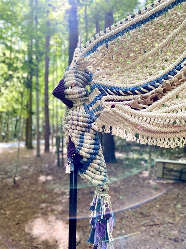 A woven structure in a forest.