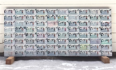 An abstract painting leaning against a wall. 