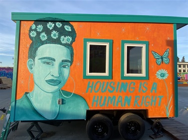 A mural painted on the side of a building. 