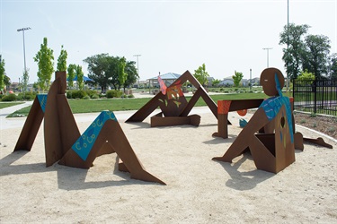 A group of abstract sculptures in a park. 