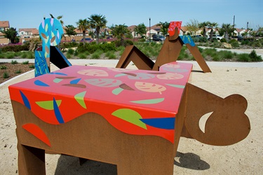 A group of abstract sculptures in a park. 