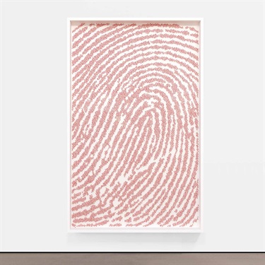 A piece of abstract artwork on the wall of a building. 