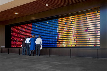 A piece of abstract artwork on the wall of a building. 