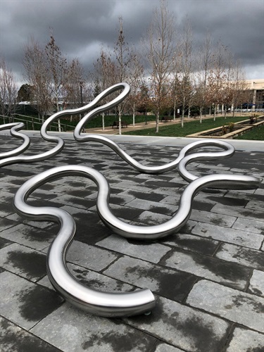 An abstract sculpture in a park.