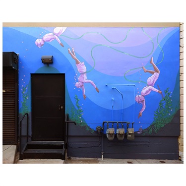 A mural painted on the wall of a building. 