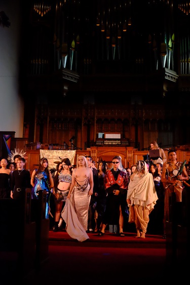 People standing on a stage. 