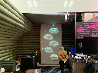 A person viewing an art projection.