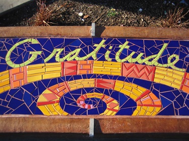 A colorful mosaic inset on the seatwalls at Willow Park. 