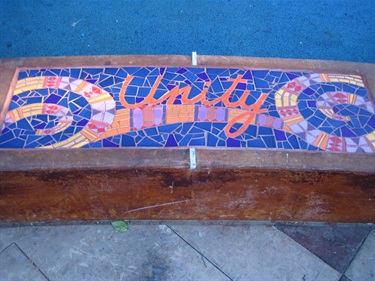 A colorful mosaic inset on the seatwalls at Willow Park. 