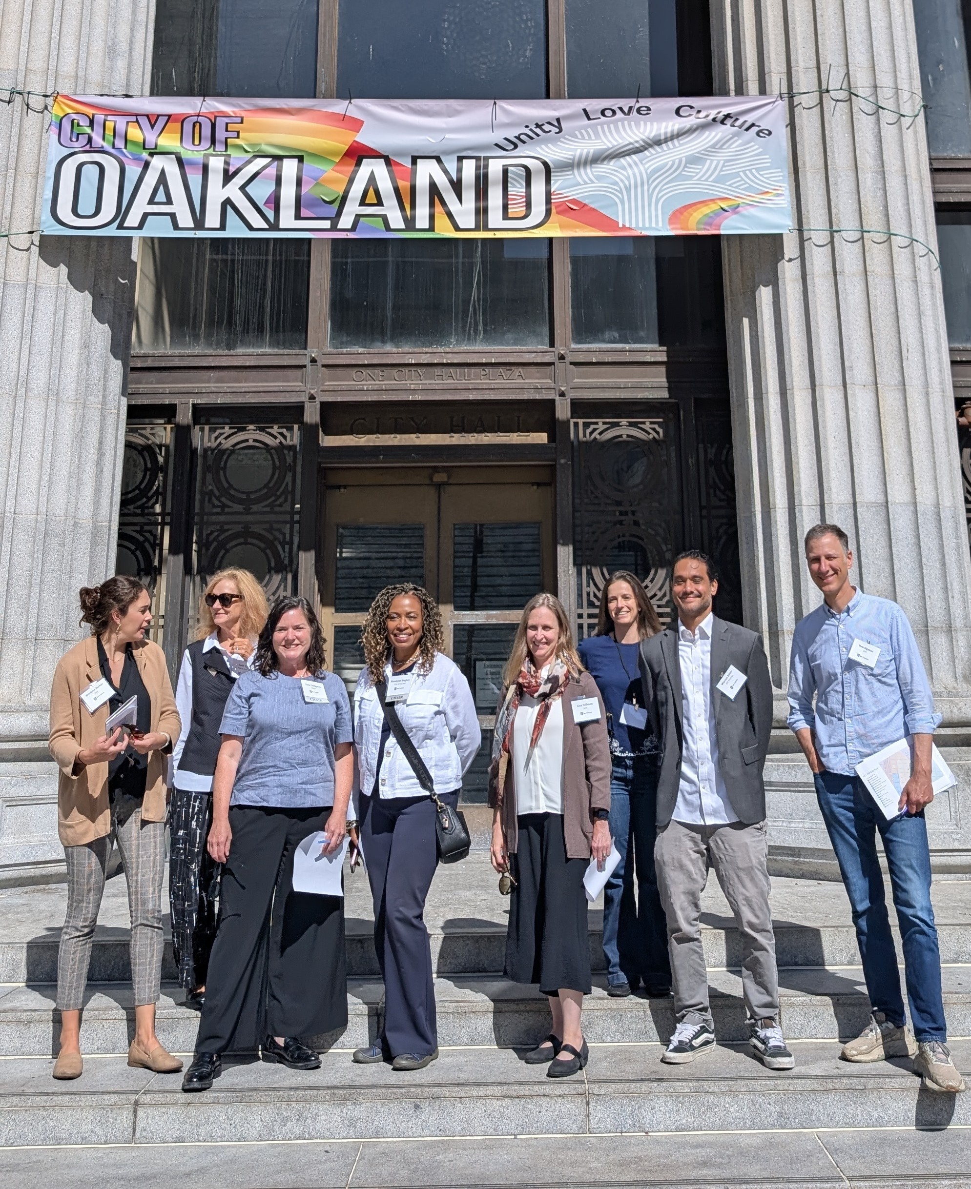 03_partnership_team_on_cityhall_steps-crop.JPG