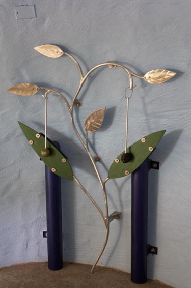 An interactive musical instrument shaped as a branch with leaves. 