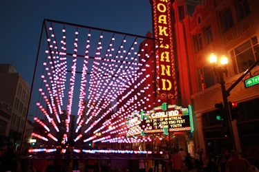 A light sculpture installed outside of a theater. 