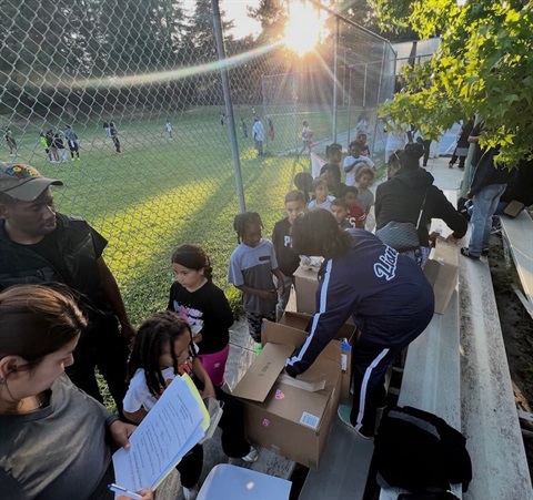 youth receiving food outside